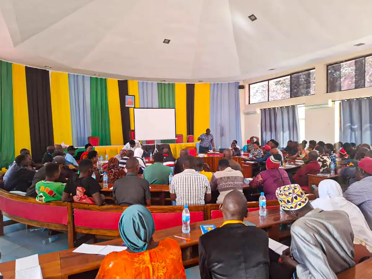 Participants seated in rows during a group presentation.